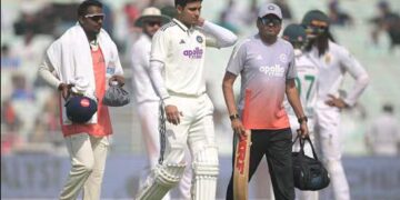 India-s-captain-Shubman-Gill--C--walks-back-to-th